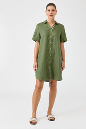 A model wearing the Studio Linen Short Shirt Dress in colour Khaki (Green), from the front, showing the whole outfit