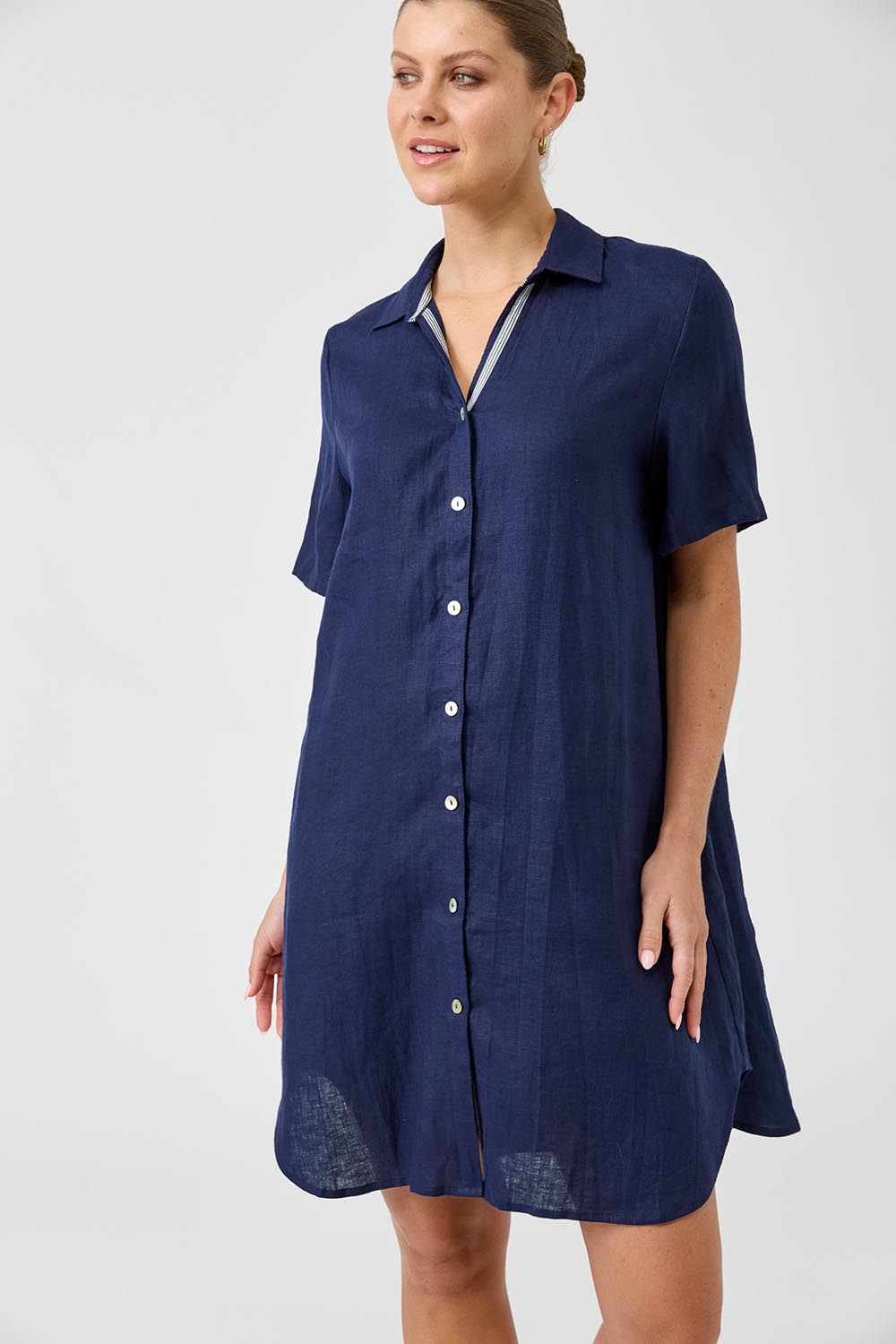 A model wearing the Studio Linen Short Shirt Dress in colour Navy (Blue), from the front, cropped image