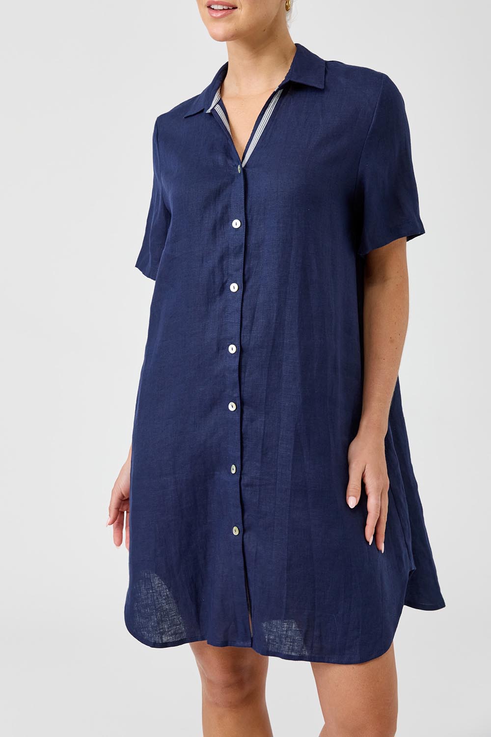 A model wearing the Studio Linen Short Shirt Dress in colour Navy (Blue), from the front, cropped image