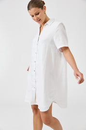 A model wearing the Studio Linen Short Shirt Dress in colour White (White), from the front, cropped image