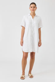 A model wearing the Studio Linen Short Shirt Dress in colour White (White), from the front, showing the whole outfit