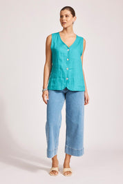 A model wearing the Miramar Linen Vest in colour Lagoon (Blue), from the front, showing the whole outfit