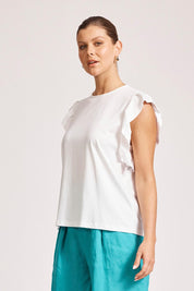 A model wearing the Francia Frill Cotton Tank in colour White (White), from the front, cropped image