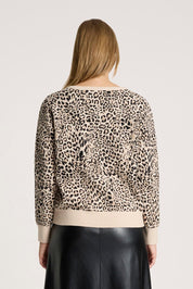 A model wearing the Zala Jumper in colour Nomad, from the back