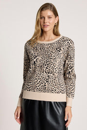 A model wearing the Zala Jumper in colour Nomad, from the front, cropped image