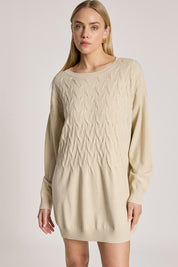 A model wearing the Samira Relaxed Knit in colour Bisque, from the front, cropped image