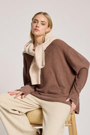 A model wearing the Apache Jumper in colour Coco, from the front, cropped image