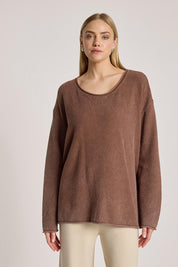 A model wearing the Apache Jumper in colour Coco, from the front, cropped image
