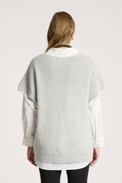 A model wearing the Berber Vest Cardigan in colour Marle (Grey), from the back
