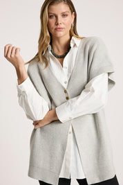 A model wearing the Berber Vest Cardigan in colour Marle (Grey), from the front, cropped image