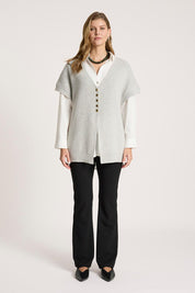A model wearing the Berber Vest Cardigan in colour Marle (Grey), from the front, showing the whole outfit