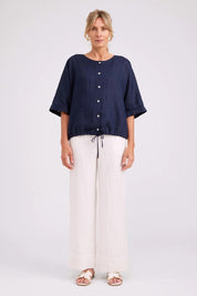 Model Genericm wearing size sample of the Studio Linen Button Top Jacket – Navy in colour Navy, from the front