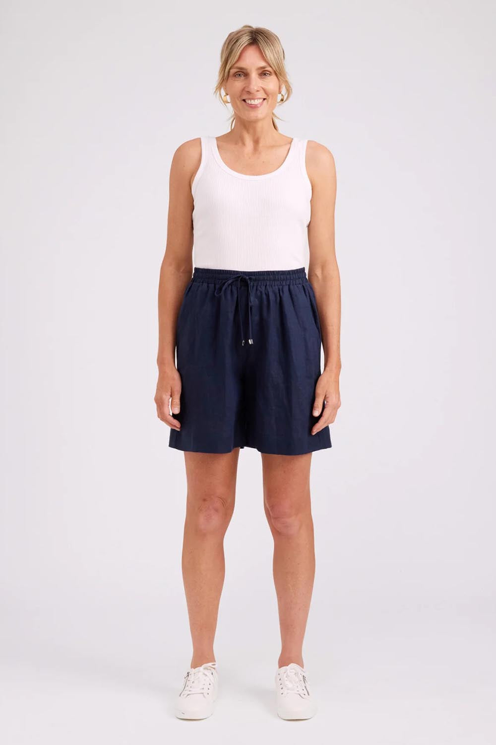 Model Genericm wearing size sample of the Studio Linen Bermuda Short – Navy in colour Navy, from the front