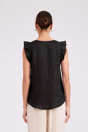 Model Genericm wearing size sample of the Studio Linen Frill Tank – Black in colour Black, from the back