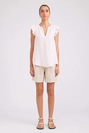 Model Genericm wearing size sample of the Studio Linen Frill Tank – White in colour White, from the front