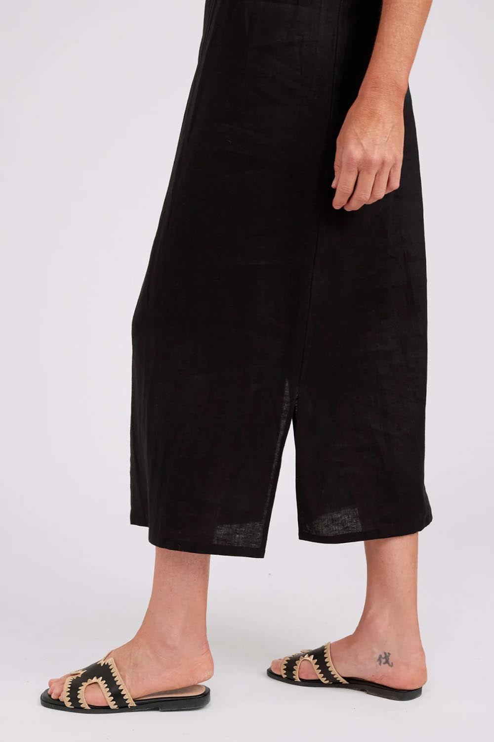 Model Genericm wearing size sample of the Studio Linen Tank Maxi Dress – Black in colour Black, from an angle