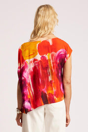 Model Genericm wearing size sample of the Palmera Top – Solara in colour Solara, from the back