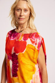 Model Genericm wearing size sample of the Palmera Top – Solara in colour Solara, in a cropped view
