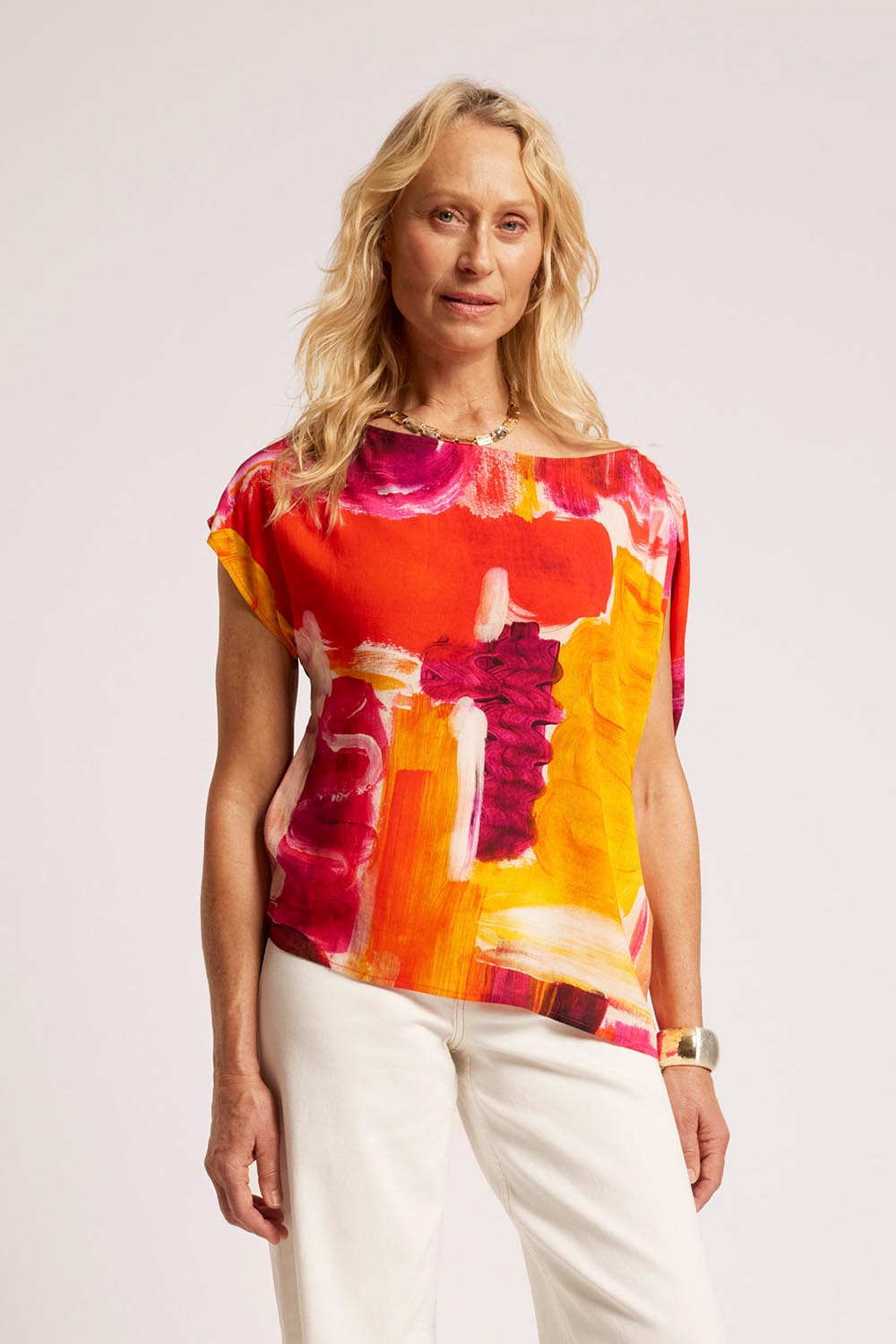 Model Genericm wearing size sample of the Palmera Top – Solara in colour Solara, in a cropped view