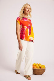Model Genericm wearing size sample of the Palmera Top – Solara in colour Solara, from the front