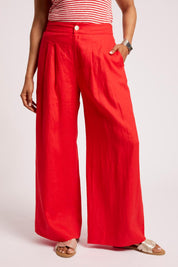 Model Genericm wearing size sample of the Cove Palazzo Pant – Aperol in colour Aperol, from the front