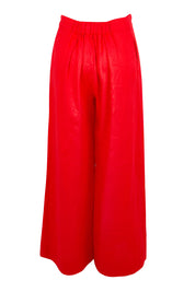 Product shot of the Cove Palazzo Pant – Aperol in colour Aperol, from the back