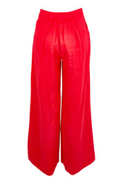 Product shot of the Cove Linen Palazzo Pant – Aperol in colour Aperol, from the back