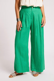 Model Genericm wearing size sample of the Cove Palazzo Pant – Jade in colour Jade, in a cropped view