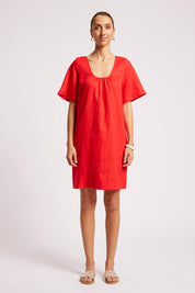 Model Genericm wearing size sample of the Cove Dress – Aperol in colour Aperol, from the front