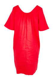 Product shot of the Cove Linen Dress – Aperol in colour Aperol, from the back