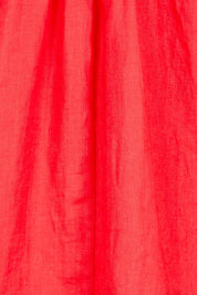 Product shot of the Cove Dress – Aperol in colour Aperol, showing detail