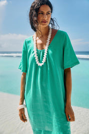 Model Genericm wearing size sample of the Cove Dress – Jade in colour Jade, in a cropped view