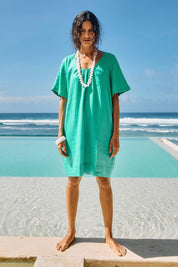 Model Genericm wearing size sample of the Cove Dress – Jade in colour Jade, from the front