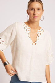 Model Genericm wearing size sample of the Maris Top – Tusk in colour Tusk, in a cropped view