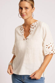 Model Genericm wearing size sample of the Maris Top – Tusk in colour Tusk, in a cropped view