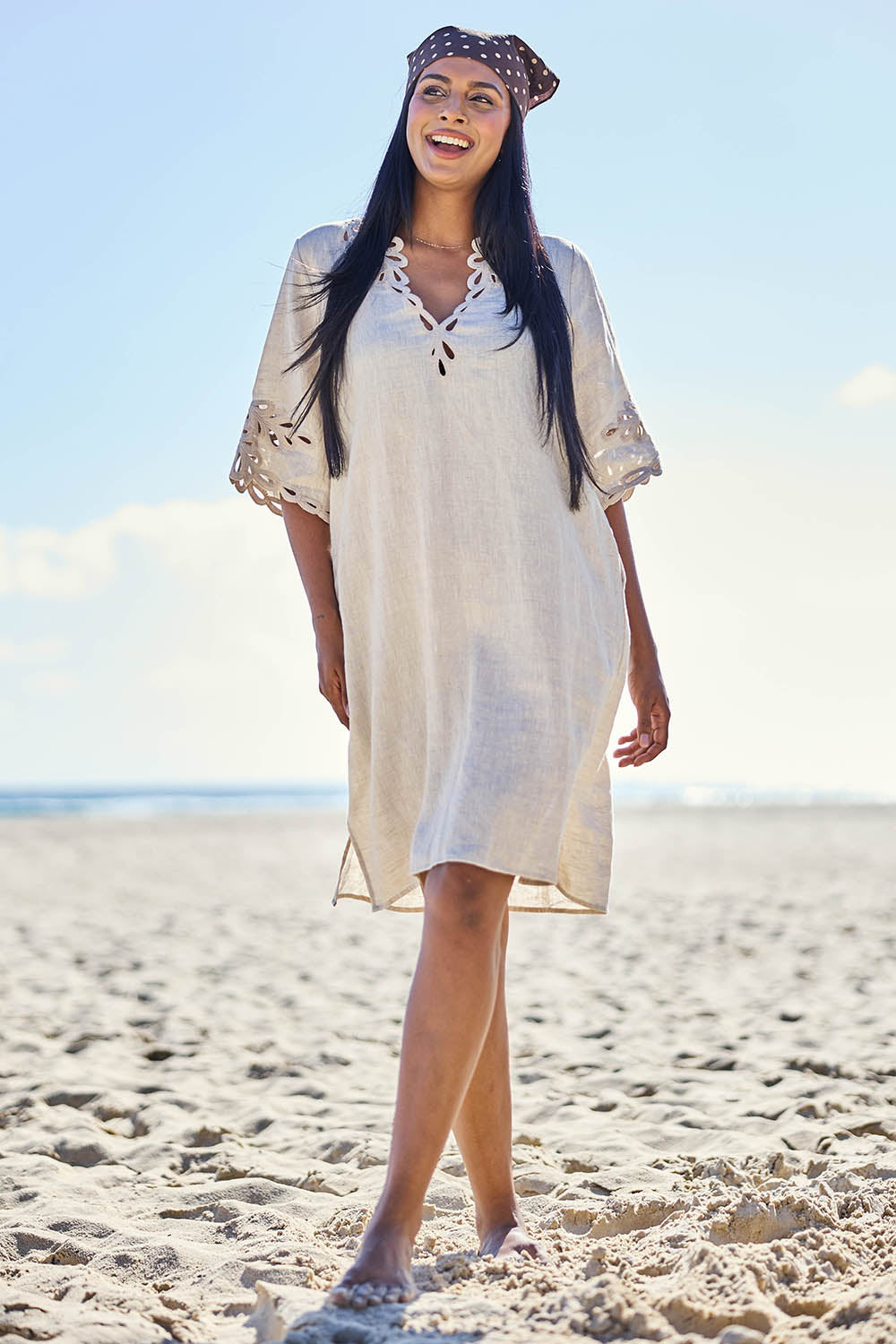 Model Eshan wearing size 10 of the Maris Dress – Tusk in colour Tusk, from the front