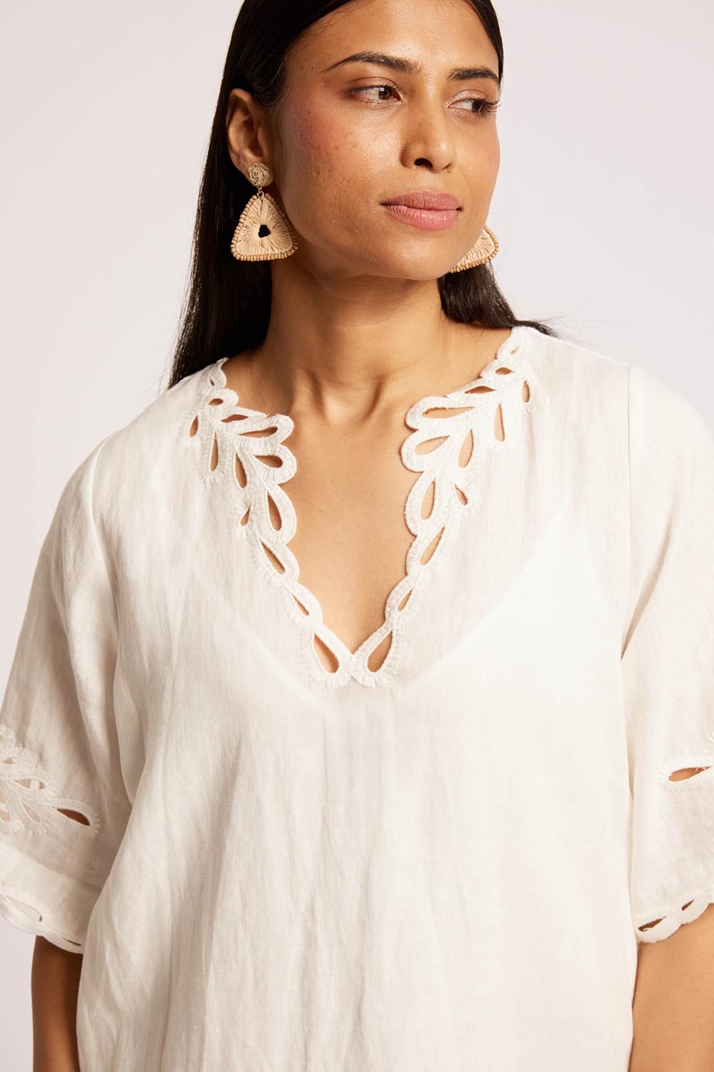 Model Genericm wearing size sample of the Maris Dress – Tusk in colour Tusk, from an angle