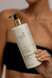 A model wearing the Coconut Body Milk in colour Milk (White), from the front, showing the whole outfit