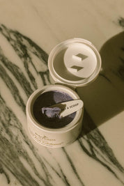 A model wearing the Super Acai Exfoliator in colour Natural, from the front, showing the whole outfit