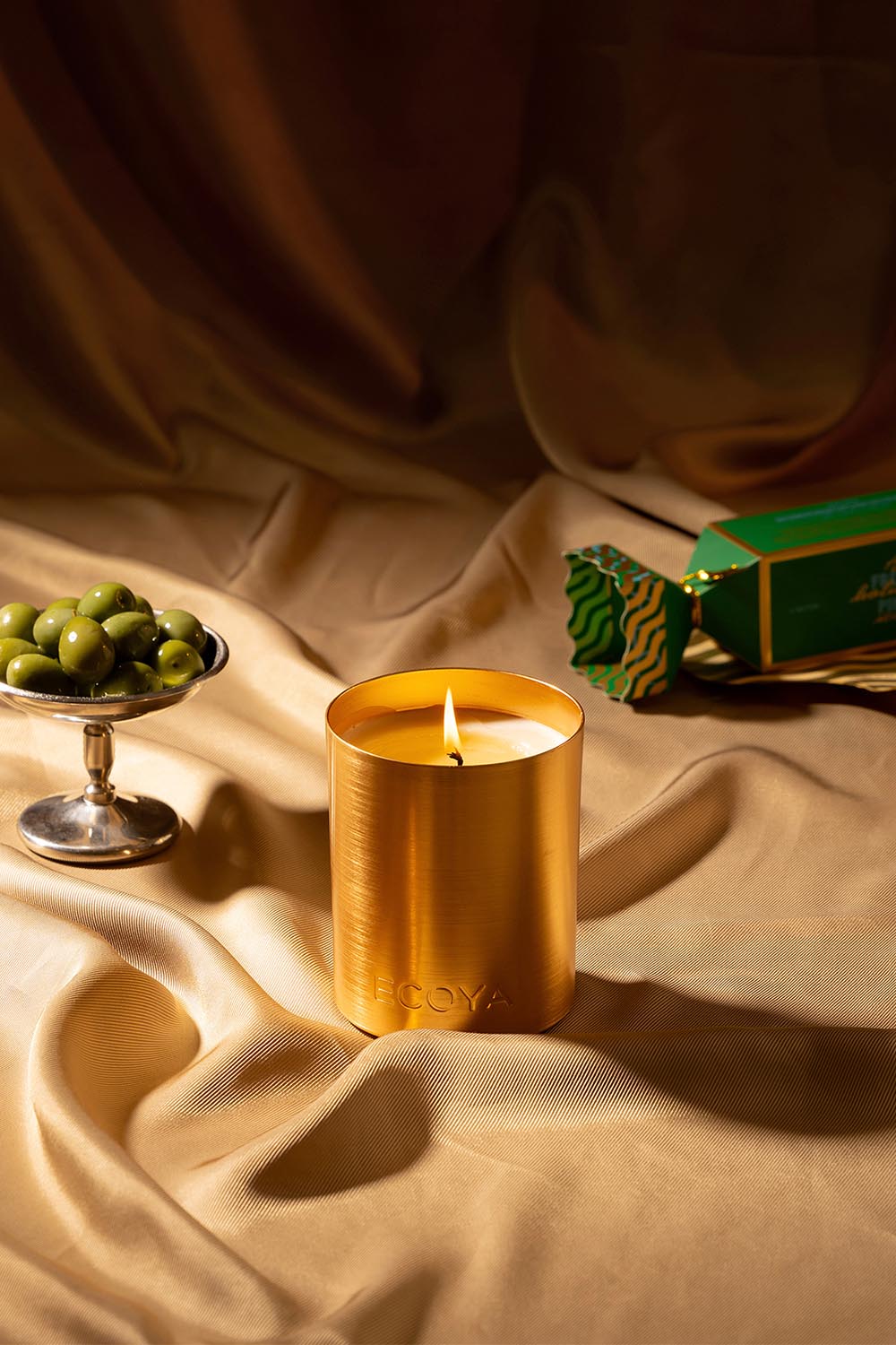 A model wearing the Mini Goldie Candle in colour Freshpine (Green), from the front, showing the whole outfit