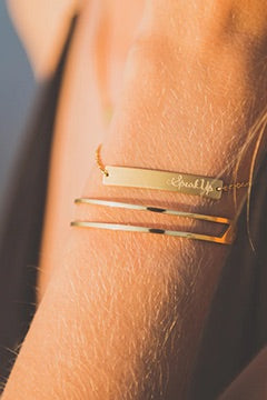 A model wearing the Faith Like A Mustard Seed Cuff Bracelet in colour Gold (Metallics), from the front, showing the whole outfit