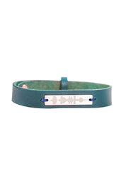 Product shot of the Light Triumphs Over Darkness Thick Vegan Leather Bracelet in colour Blue (Blue), from the front