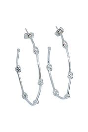 Product shot of the Knots Of Freedom Hoop Earrings in colour Steel (Metallics), from the front