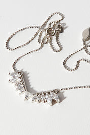 A model wearing size OneSize of the Time To Rise Necklace in colour Silver (Metallics), from the front, showing the whole outfit