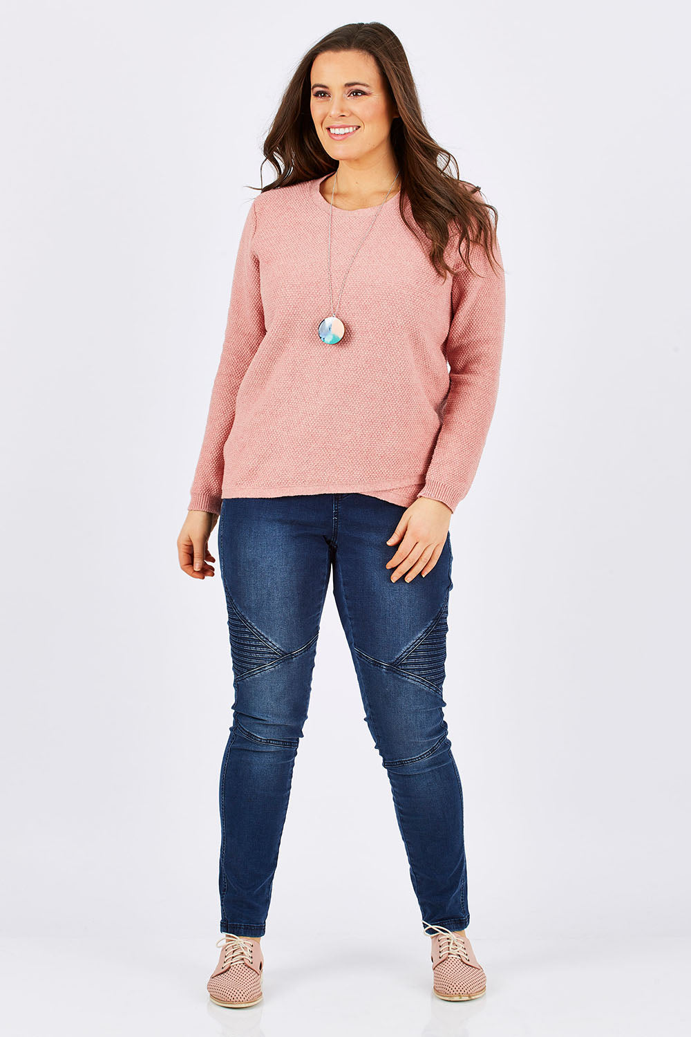 Model Tia wearing size 14 of the Maple Knit in colour PinkMarle (Pink), from the front, showing the whole outfit