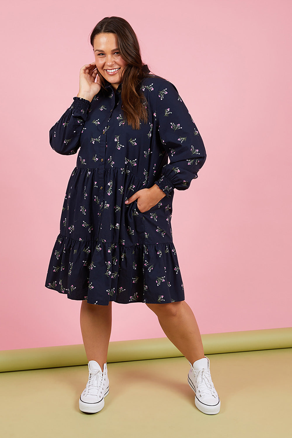 A model wearing the Jolie Floral Shirt Dress in colour Navyfloral (Blue), from the front, showing the whole outfit