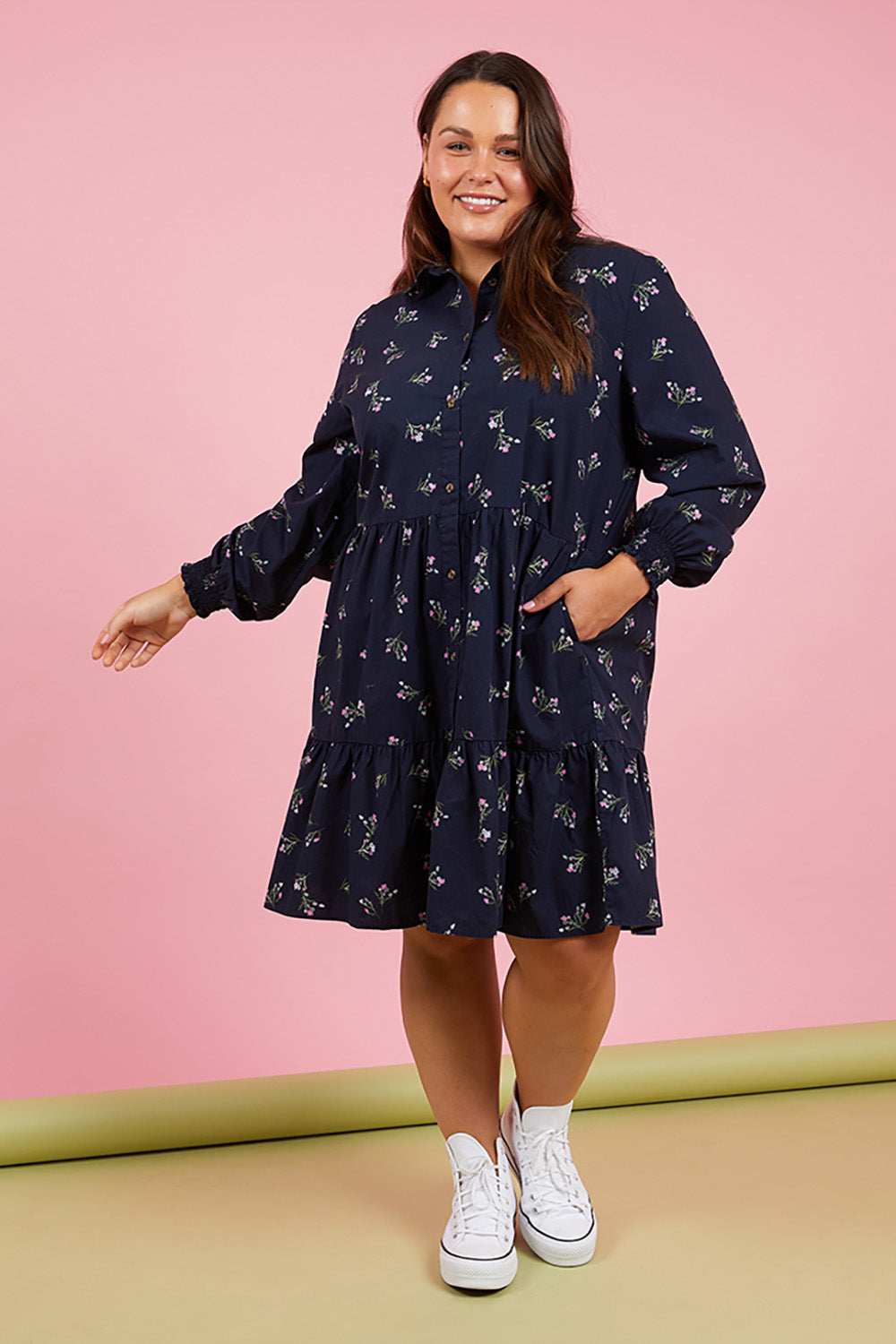 A model wearing the Jolie Floral Shirt Dress in colour Navyfloral (Blue), from the front, showing the whole outfit