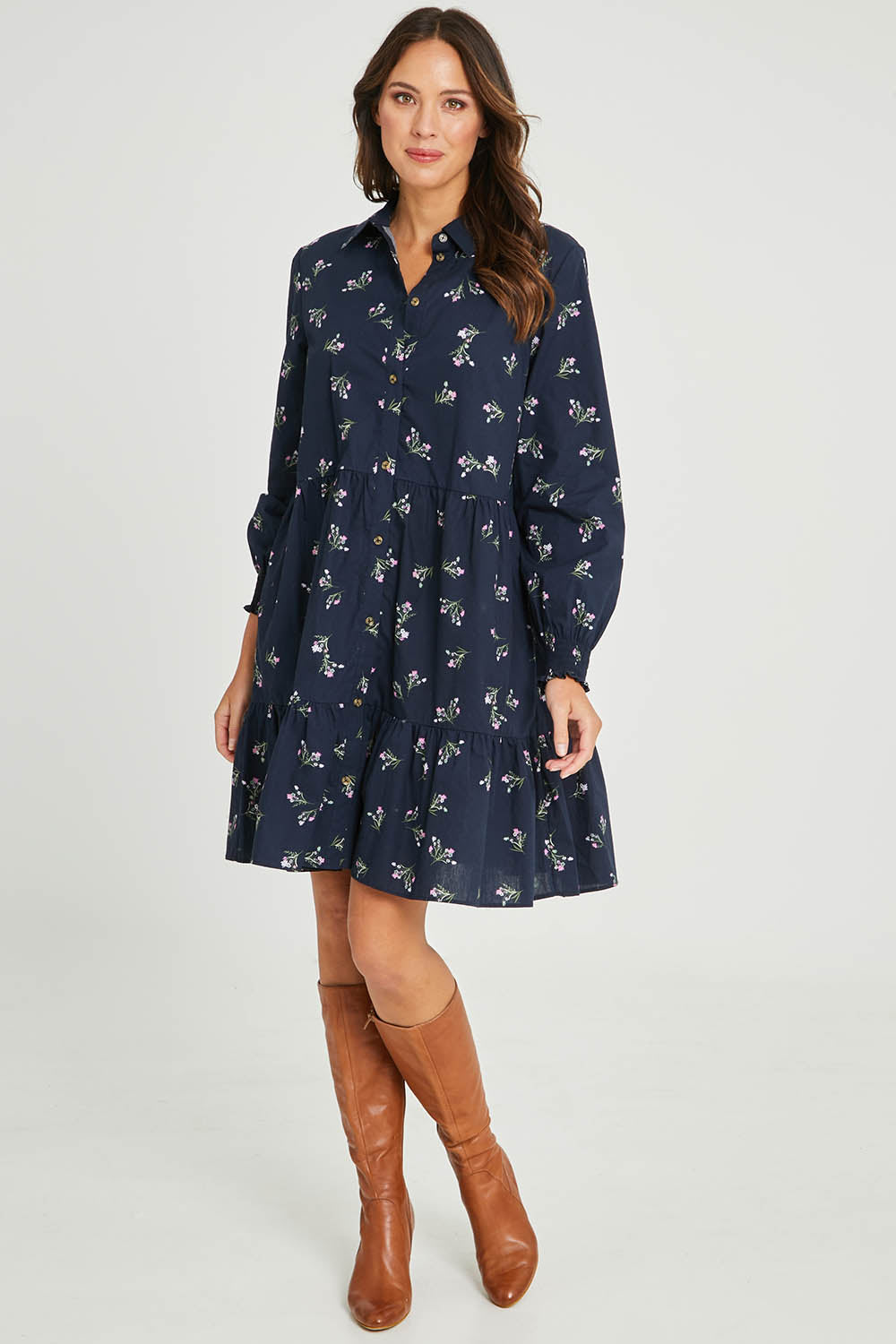 Model Madeline wearing size 10 of the Jolie Floral Shirt Dress in colour Navyfloral (Blue), from the front, showing the whole outfit