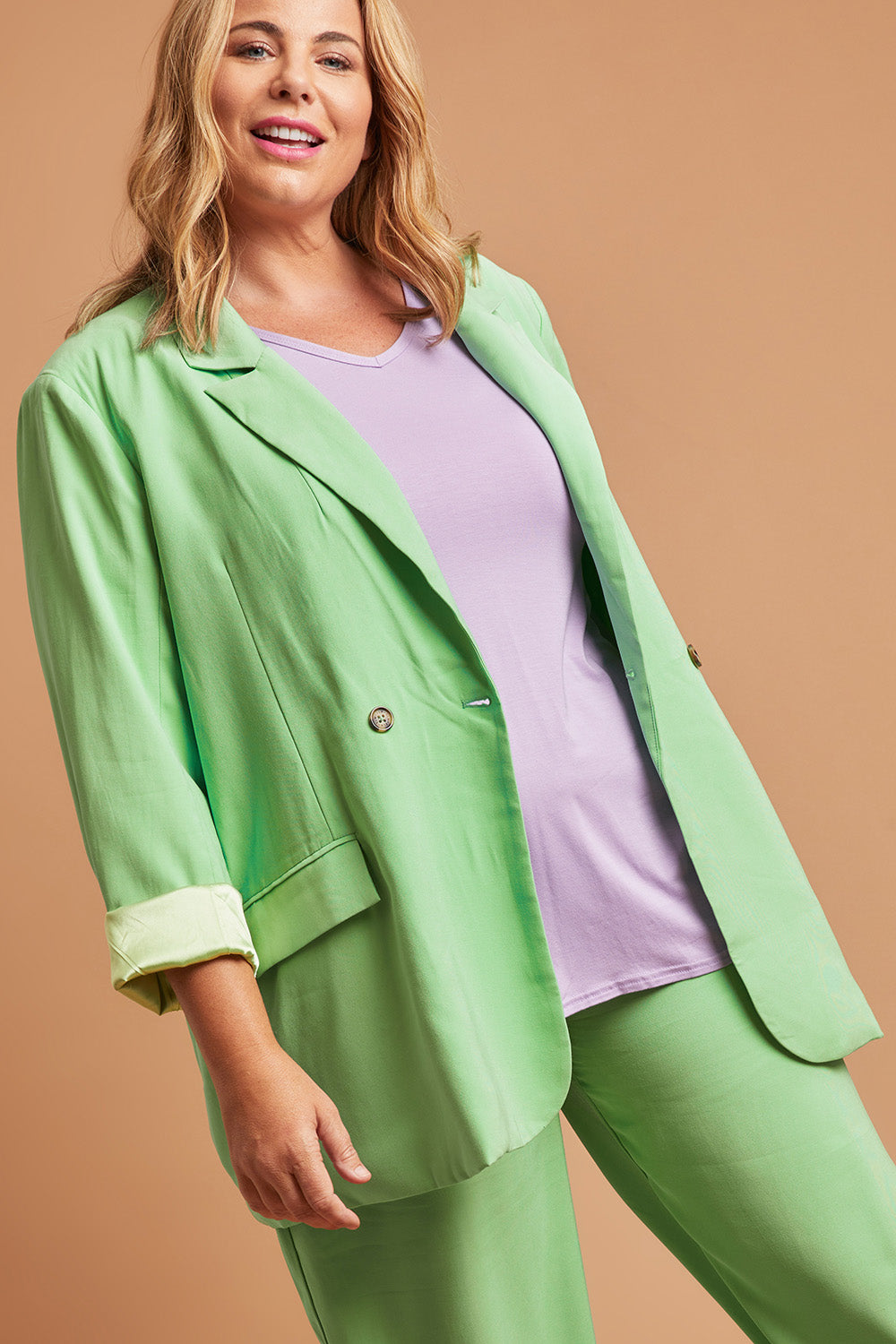 Model Fiona wearing size 16 of the Rhiannon Blazer in colour Meadow (Green), from the front, showing the whole outfit