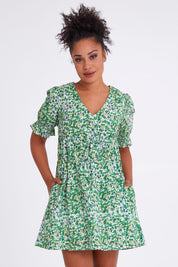 Model Olivia wearing size 10 of the Prairie Floral Dress in colour Prairie (Green), from the front, cropped image